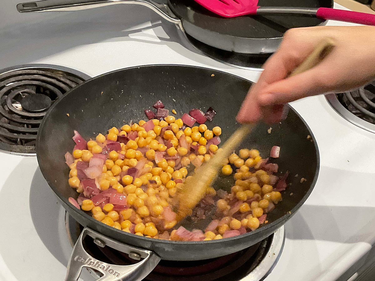 Add chickpeas to the pan once the onions are translucent