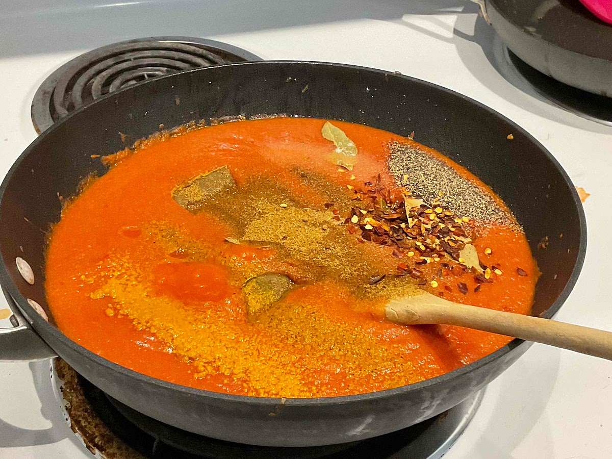 Add in the spices and then add in the curry cubes 3 at a time, be sure to mix as you add them in!