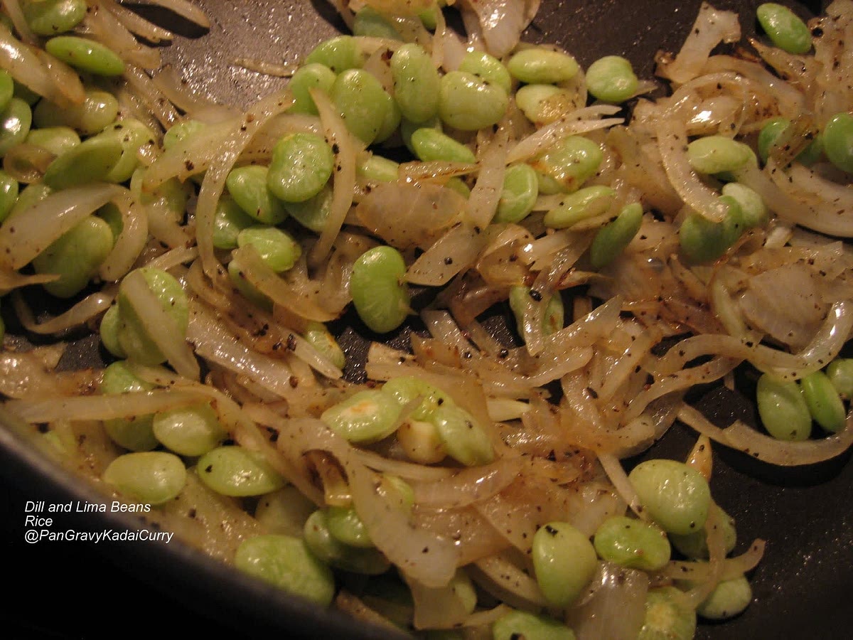 In a pan, heat the Olive Oil and saute the garlic, onions till the onions are slightly brown.Add a good grind of pepper, salt and Lima beans. Stir until the beans are coated with the seasonings.