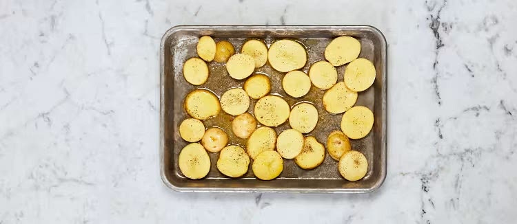 Preheat oven to 450 degrees. Wash and dry produce. Slice potatoes into ¼-inch-thick rounds. Trim green beans if necessary. Trim and thinly slice mushrooms (skip if your mushrooms are pre-sliced!). Halve, peel, and finely chop onion until you have ¼ cup (½ cup for 4 servings). Toss potatoes on a baking sheet with a drizzle of oil, salt, and pepper. Roast for 8 minutes (you’ll roast the green beans then).