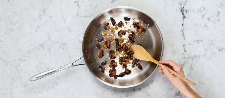 Meanwhile, heat a drizzle of oil in pan used for steak over medium-high heat. Add mushrooms and cook, stirring, until browned and tender, 5-7 minutes. Add chopped onion and another drizzle of oil. Cook, stirring, until softened, 1-2 minutes.