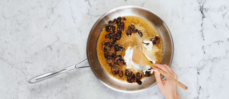 Stir stock concentrate and ¼ cup water (⅓ cup for 4 servings) into pan with mushroom mixture. Simmer until slightly thickened, 2-3 minutes. Remove from heat; stir in sour cream and 1 TBSP butter (2 TBSP for 4). Season generously with pepper.