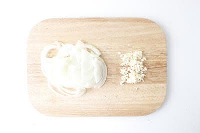 Boil a kettle.
Peel and finely slice your brown onion[s].
Peel and finely chop (or grate) your garlic.