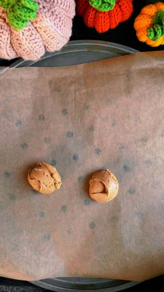 Scoop out the cookie dough onto a large baking tray, lined with baking paper, using an ice-cream scoop. This recipe should make approximately 15 cookies, but you can make them bigger or smaller, depending on your preference. If the dough gets stuck to the scoop, dip the scoop in water before each use and it will stop it from sticking.