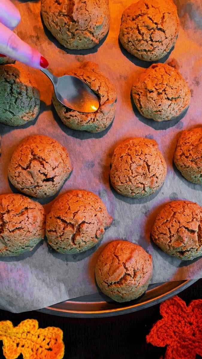 Bake the cookies in the oven at 190 degrees celsius for approximately 10-12 mins. They should still be slightly soft when you take them out. Once baked, use a teaspoon to push the middle down and form a dent in each cookie.