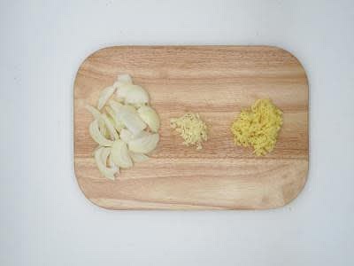Boil a kettle Peel and finely slice your brown onion[s] Peel and finely chop (or grate) your garlic Peel (scrape the skin off with a teaspoon) and finely chop (or grate) your ginger