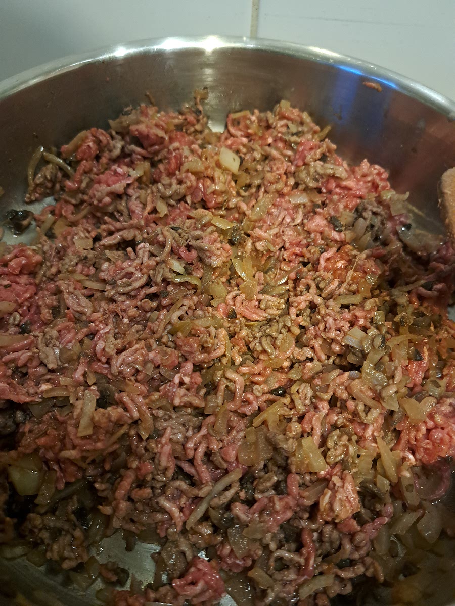 Add in the mince meat and sprinkle seasoning on top. Mix it well and let it cook until the meat is (brown if beef, white if pork, chicken or turkey).