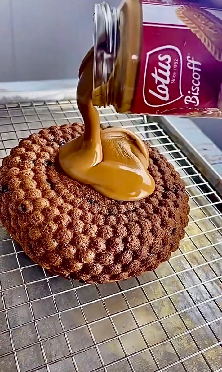 Line and grease a 21 cm cake pan or a silicone mold if you have one . Add the cake batter then tap it down to smooth it out and bake at 170 c 350 f for 35-40 minutes or until a skewer inserted into the center of the cake comes out clean .
