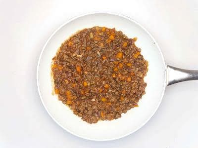 Once the vegetables have softened, increase the heat to high and add your beef mince to the pan and cook for 3-4 min or until browned, breaking it up with a wooden spoon as you go Once the beef has browned, add the tomato stock to the pan Season with a grind of black pepper and cook for 4-5 min or until slightly thickened and the beef is cooked through (no pink meat!) – this is your beef mixture