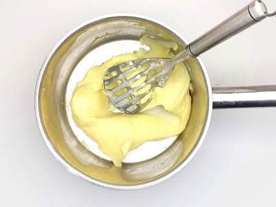 While the beef mixture thickens, return the drained potatoes to a low heat with a small knob of butter, a splash of milk and a pinch of salt and pepper Mash until smooth Grate your cheddar cheese