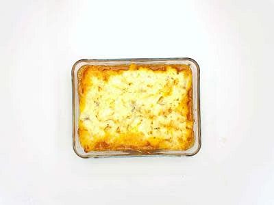 Once the beef mixture has thickened, transfer it to an oven-proof dish Top with the mashed potato and sprinkle over the grated cheese Put the dish in the oven for 15-20 min or until golden brown and bubbling – this is your cottage pie