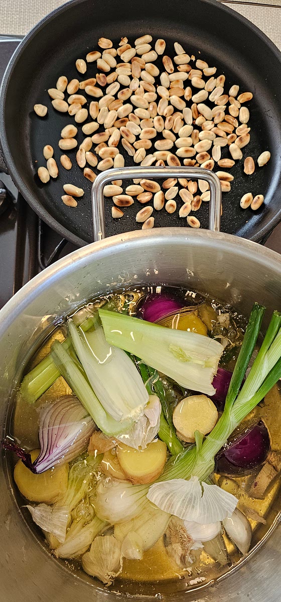 Heat both oils to around 150c in a pot - use a temperature probe, if you have one! Place the wet aromatics and steep with gentle frying for around 45mins...The ingredients should gently sizzle and wilt but not crispen or burn!