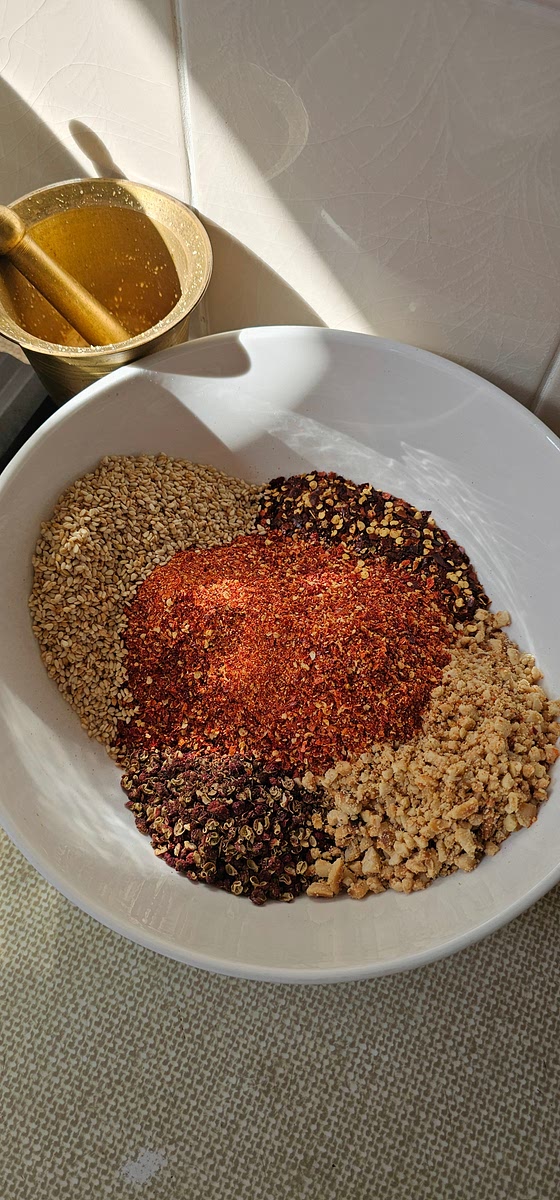 Whilst step 3 & 4 is happening - prepare all the goodness that will go into the chili oil. - Toast the sesame seeds until golden brown - Toast the peanuts and cool down, then grind with pestle & mortar. - Blend the dried Sichuan chillis in a blender into flake consistency - Measure out the Sea Salt