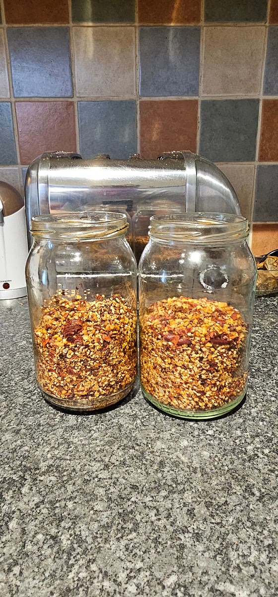 Separate the chili oil solids into jars as little as 2/3 full to 1/2 full...the latter being the better option!