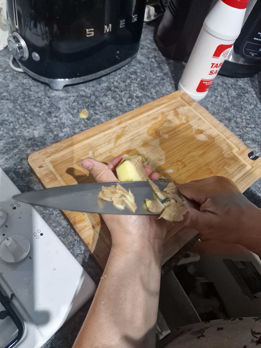 Peel ginger, crush and chop into medium-small slices