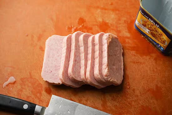 Slice the Spam into 8 even slices (about 1/4 inch thick).