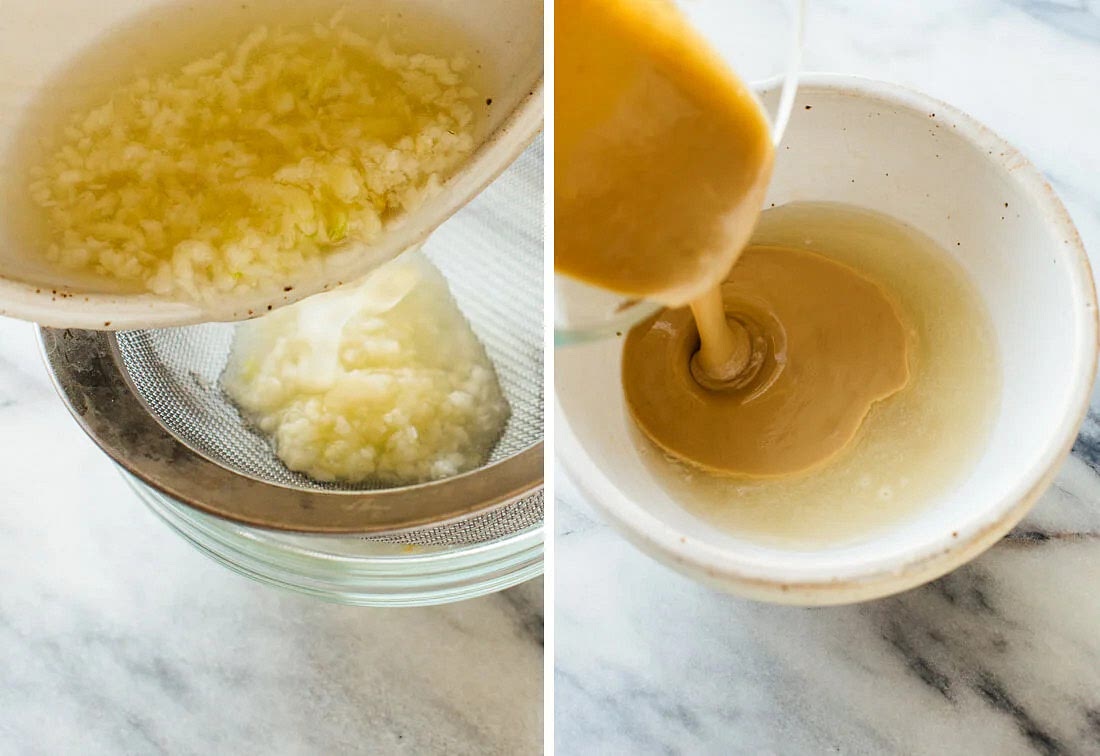 First, make a paste of seasame seed, oil to make a tahini paste. Then marinate the garlic in lemon juice for 10 minutes. The acidity of the lemon juice prevents the garlic from becoming too harsh (here’s why). This way, your lemon juice is infused with delicious, mellow garlic flavor. Strain the garlic out of the lemon juice. I know, this sounds like extra work, but it’s worth it (I tried both strained and non-strained versions). This step ensures perfectly smooth tahini sauce and prevents the garlic flavor from stealing the show after all. Time saver: If you’re in a hurry, skip the garlic altogether and whisk in the lemon juice during the following step.