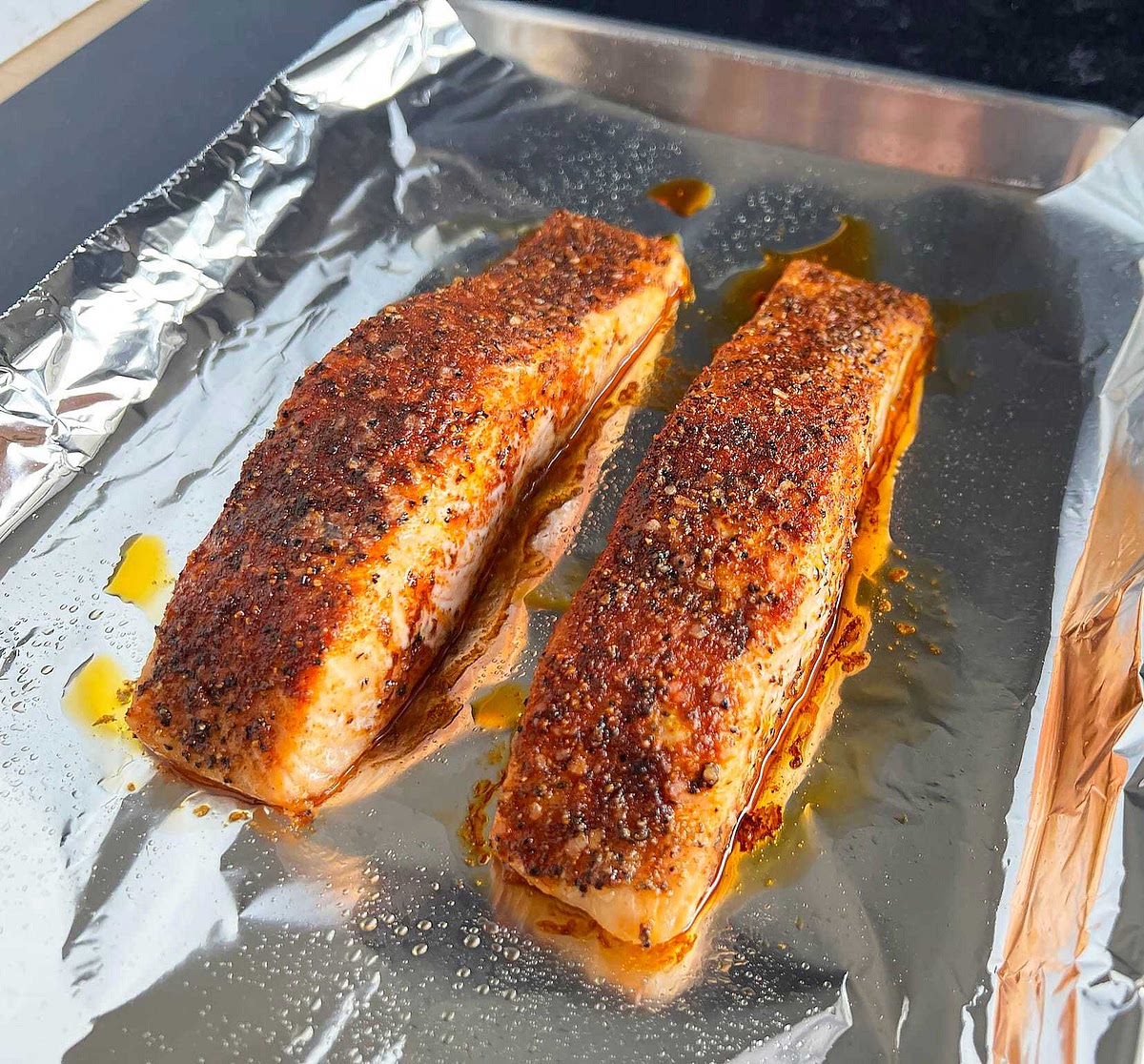 Line salmon on pan with oil covered tinfoil and add to oven along with asparagus and potatoes. Cook until desired time.