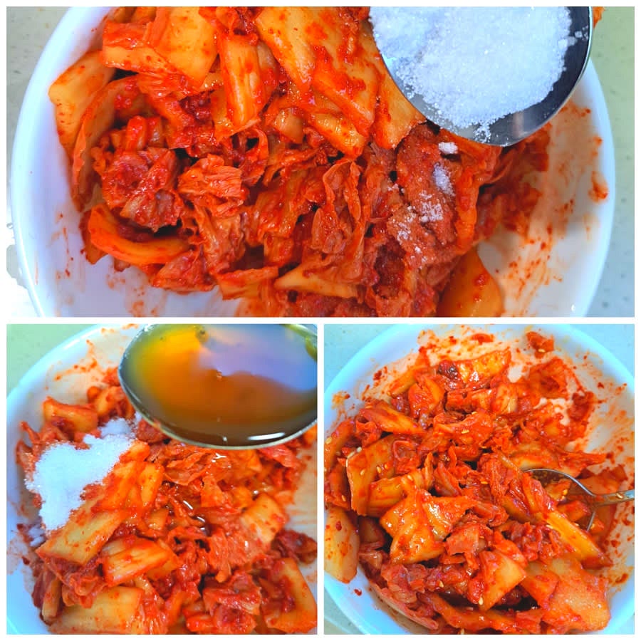 신 김치를 적당한 크기로 자르고 참기름, 설탕, 깨소금을 넣어 버무립니다.