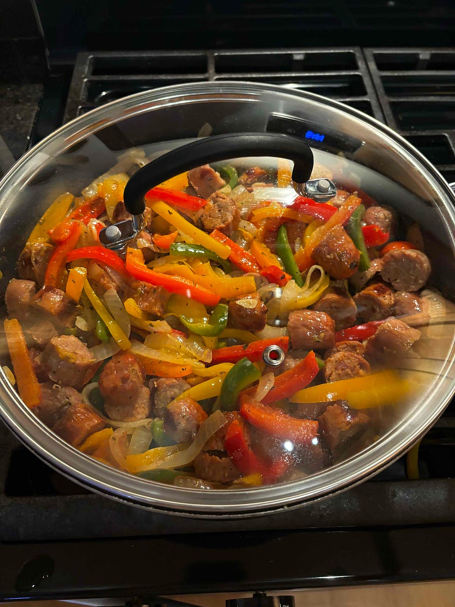 Add onions and sausage back into pan, and stir. Add lid and let simmer on low/medium with lid for about 10 minutes.