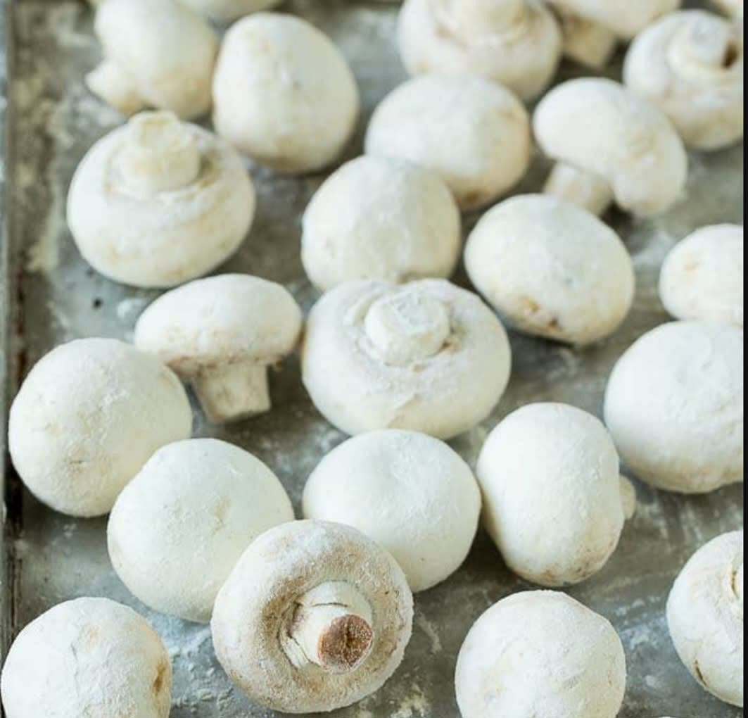 Dry them ( the mushrooms )and coat in flour