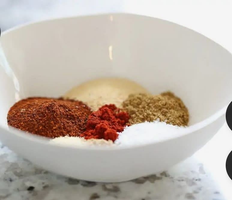 Now, take a separate bowl and add crumbed cornflakes, paprika, herb spice, pepper, and salt ( and more optional spices)