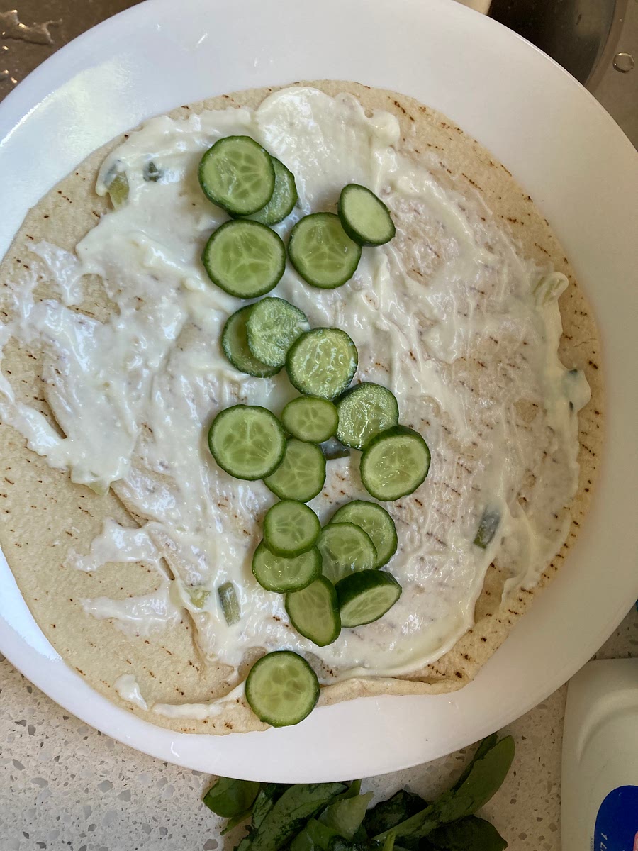 Spread cucumber along bread