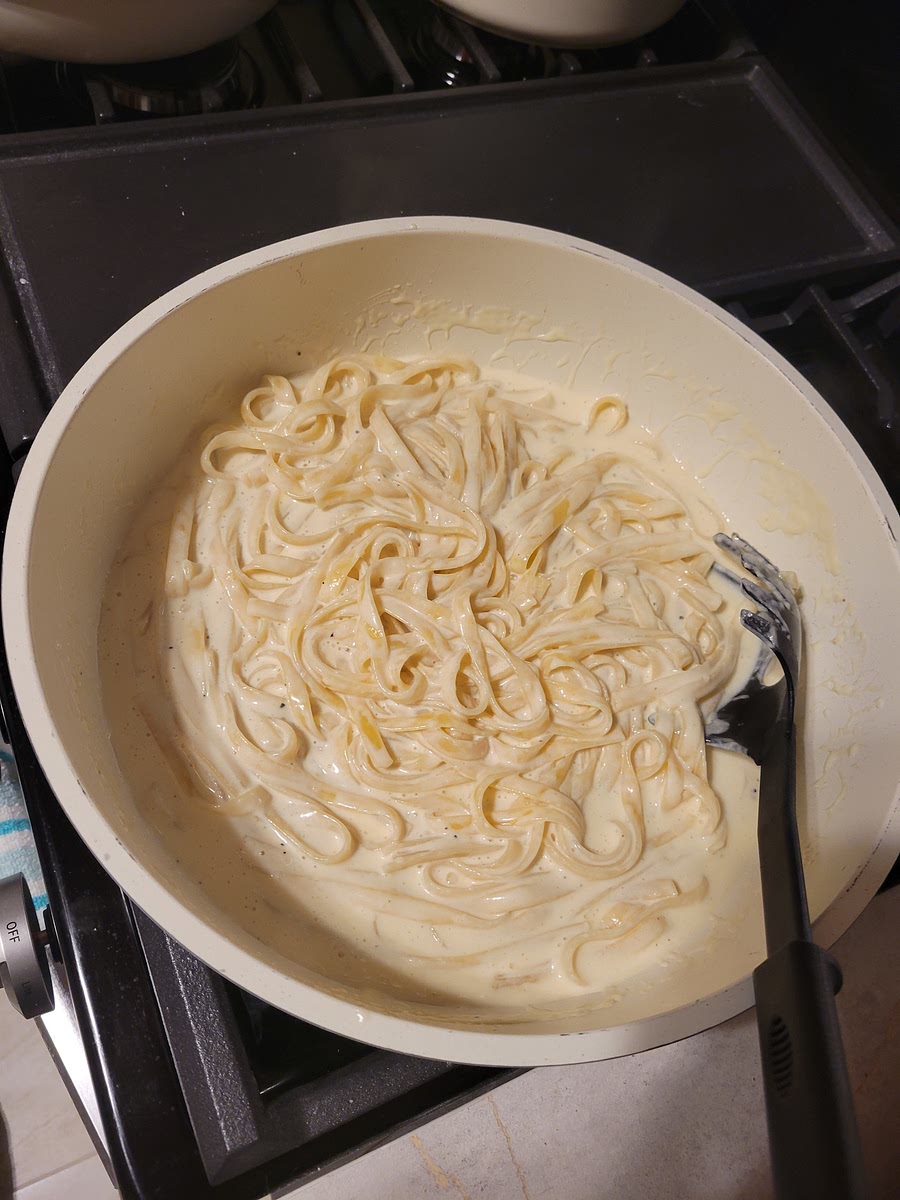 Once noodels are cooked, add to the Alfrado sauce and mix together