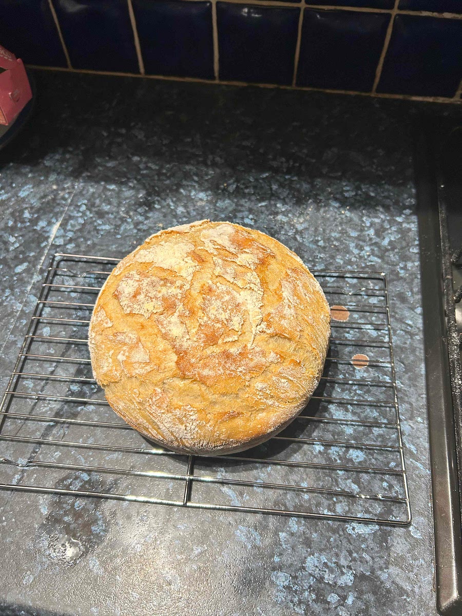 Once bread is cooked carefully remove from Dutch oven and leave to rest on raised baking grate. Do not cut into bread until it has cooled