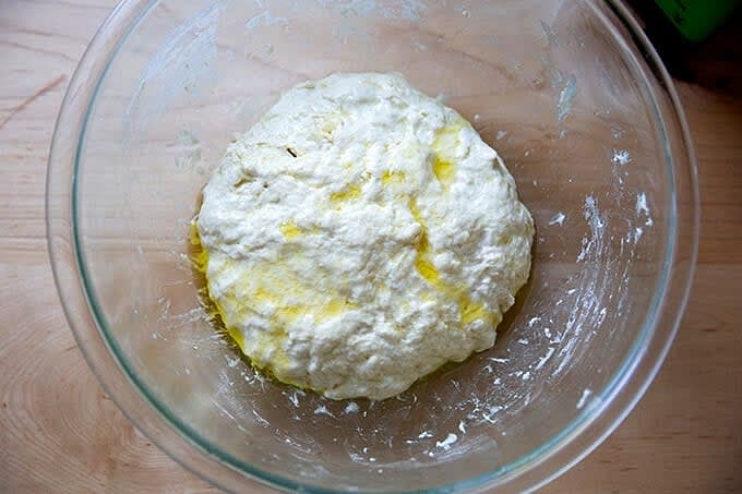 Rub the surface of the dough lightly with olive oil.
