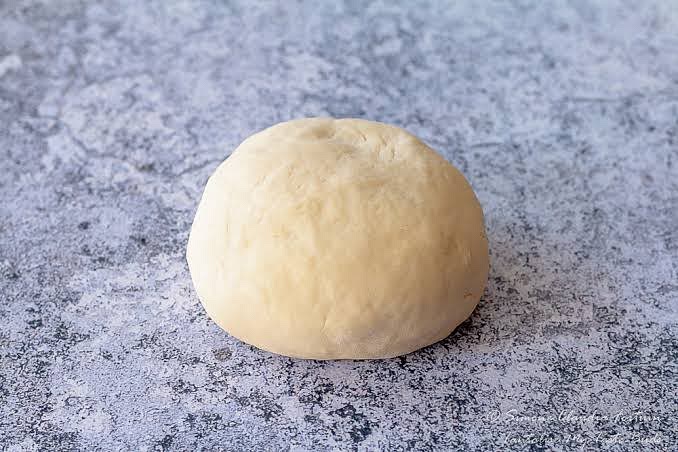 Stir the dough until the mixture forms a soft ball. Cover and place in the fridge to chill for 10 minutes.