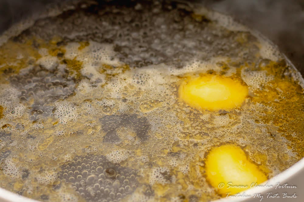 In a saucepan, bring the butter and water to a boil.