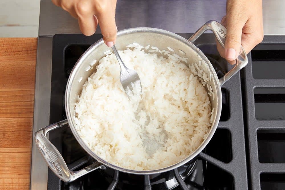 In a medium pot, combine the rice, a big pinch of salt, and 2 cups of water. Heat to boiling on high. Once boiling, reduce the heat to low. Cover and cook, without stirring, 12 to 14 minutes, or until the water has been absorbed and the rice is tender. Turn off the heat. Fluff with a fork.
