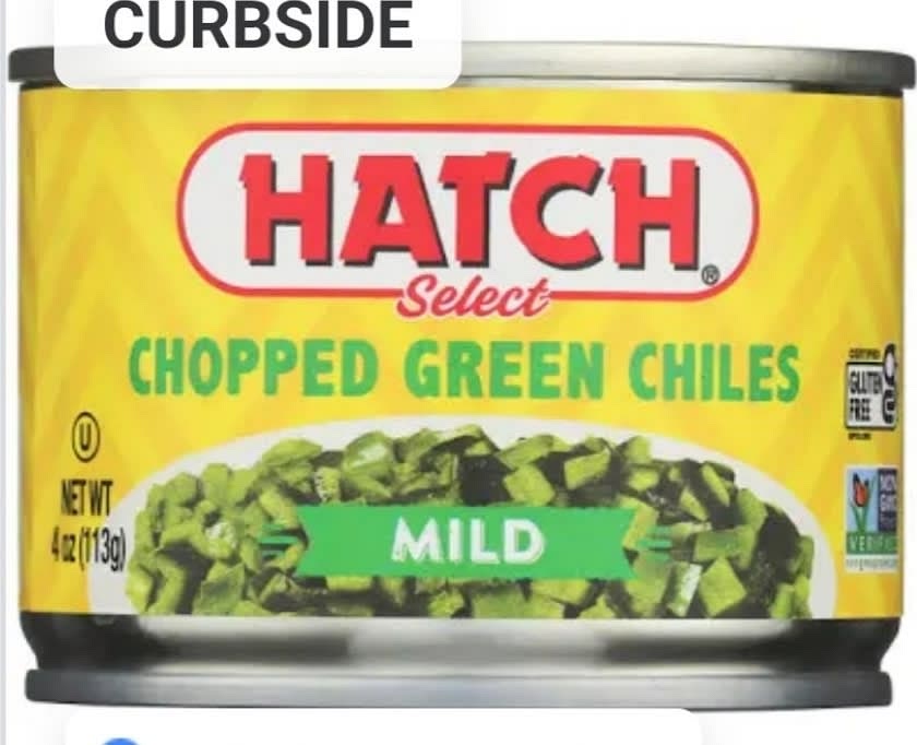 Add in 1 can of hatch green chilies at bottom of pumpkin then add in medium portion of shredded cheese.