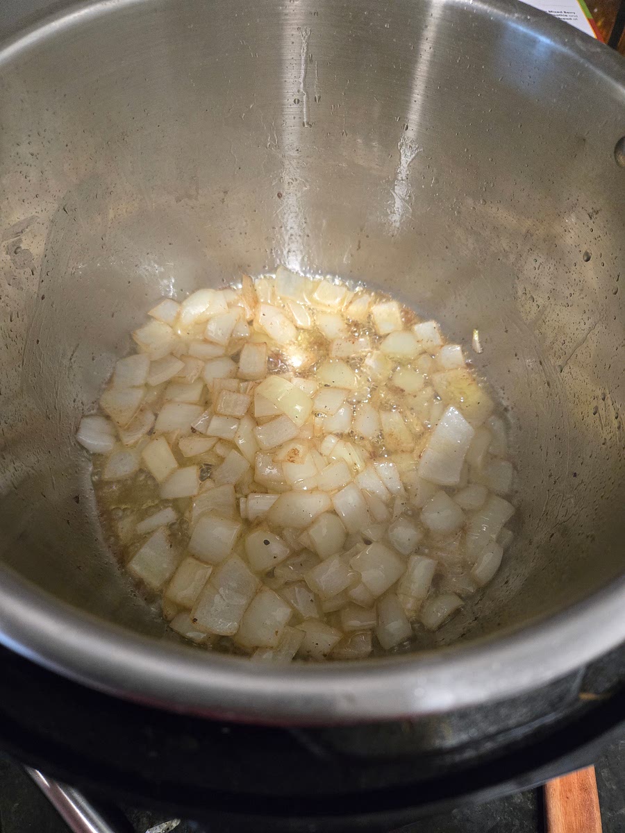 Add the sliced onion to the Instant Pot and sauté for 2-3 minutes until softened. Stir occasionally.