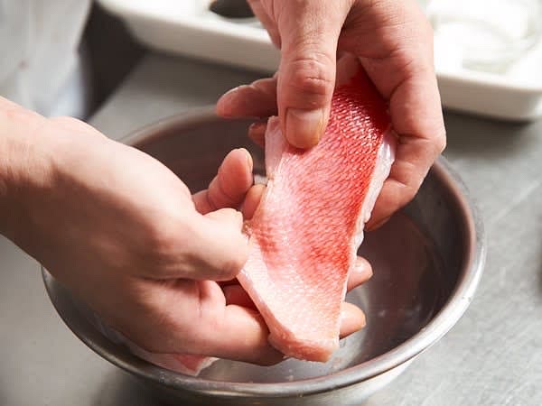 "Wash the fillets by gently stroking them with your fingers. You don't need to scrub too hard."