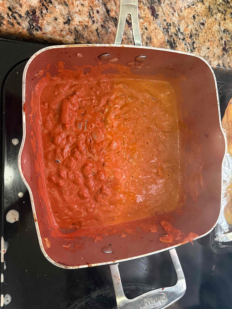 Add chili flakes, tomato paste, vodka, then simmer/combine and add in cream
