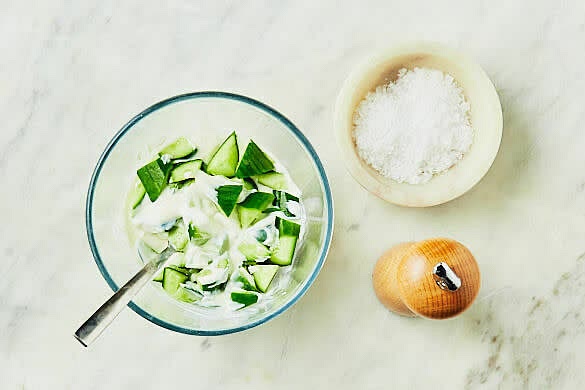 Make cucumber yoghurt. Combine the cucumber and yoghurt in a bowl and season with salt and pepper.