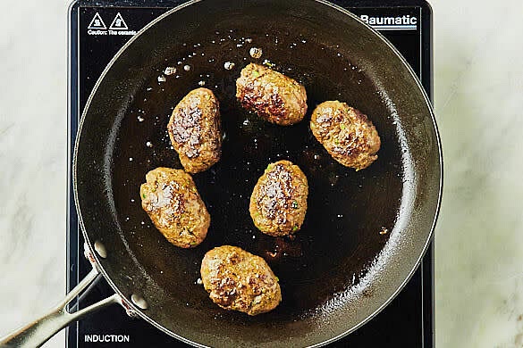 Cook the koftus. Put the parsley stems, beef mince and 1½ tbs kofta seasoning in a large bowl and season with salt and pepper. Using damp hands, combine well, then shape into 12 oval-shaped kofta. Heat 1 tbs olive oil in a medium frypan over medium heat. Cook the kofta, turning occasionally, for 10 mins or until browned and cooked through.
