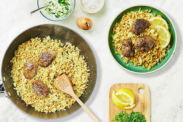 Cut the lemon into wedges. Divide the cauliflower 'rice', koftas and cucumber yoghurt among plates. Scatter with the remaining parsley and serve with the lemon wedges.
