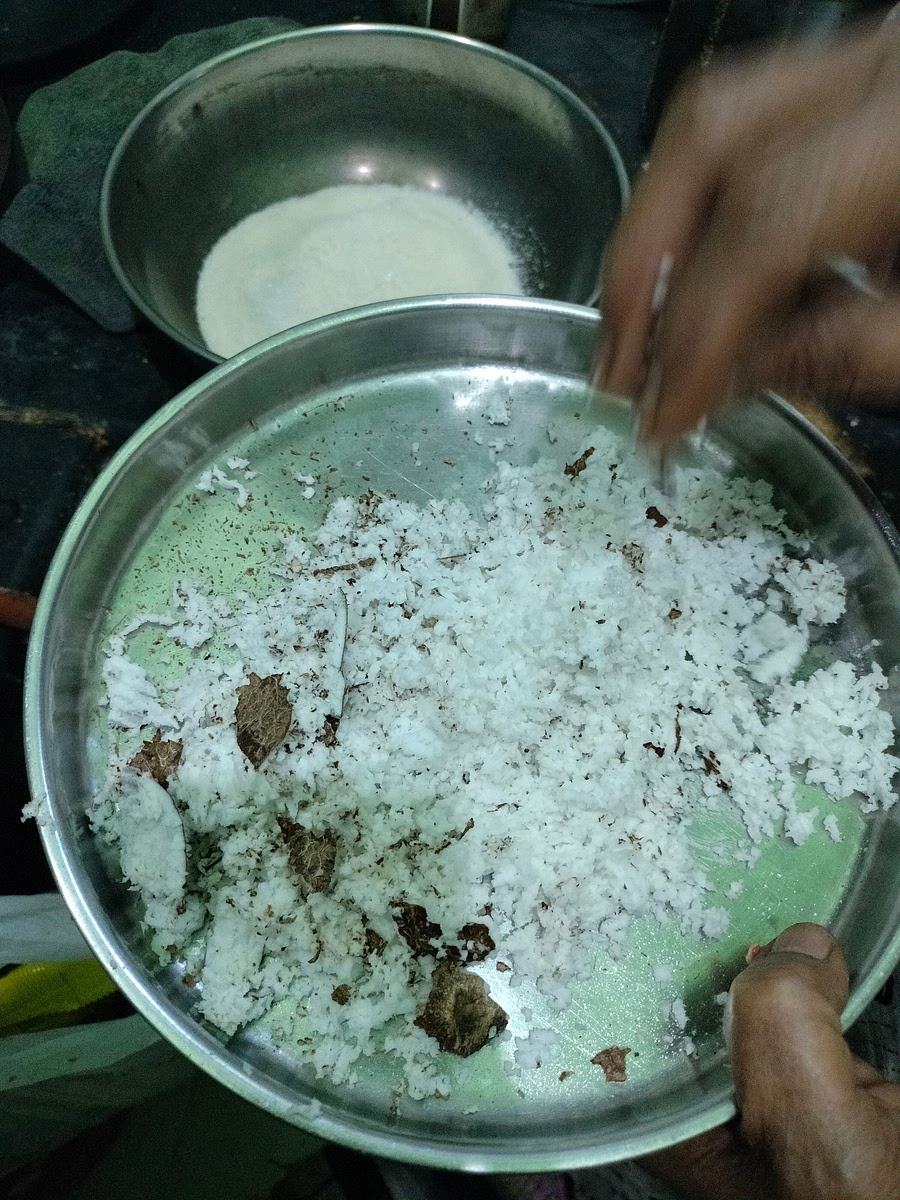 Take half a coconut and scrape it.