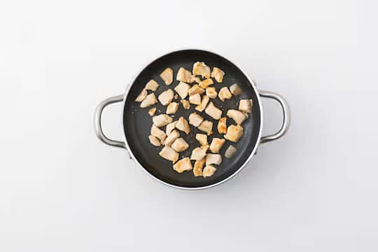Heat a large saucepan on medium-high heat with a drizzle of oil.
Once hot, add the chicken and fry until brown all over, 4-6 mins. Season with salt and pepper. Turn occasionally. IMPORTANT: Wash your hands and equipment after handling raw chicken and its packaging.