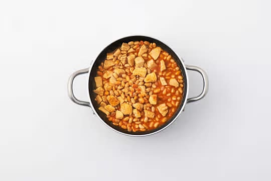 Next, add the broth paste, butter beans and water (see pantry). Bring to the boil, stir and lower the heat so the broth simmers gently. Cook for 2 mins.