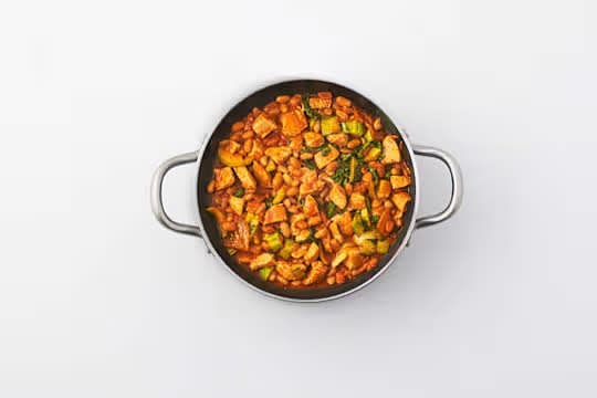 Add the pak choi and simmer for a further 2-3 mins.
Remove from the heat and stir half the kimchi and the lime juice through the broth. IMPORTANT: The chicken is cooked when no longer pink in the middle.