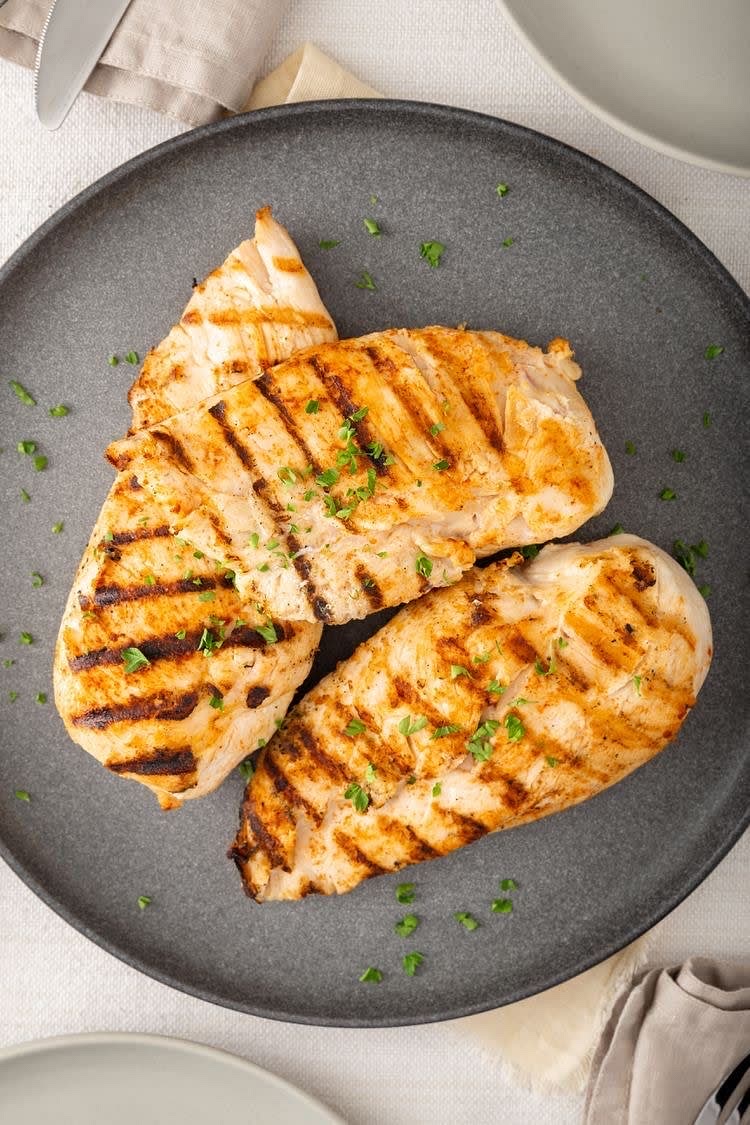 Add the protein – Slice grilled chicken and place on top.