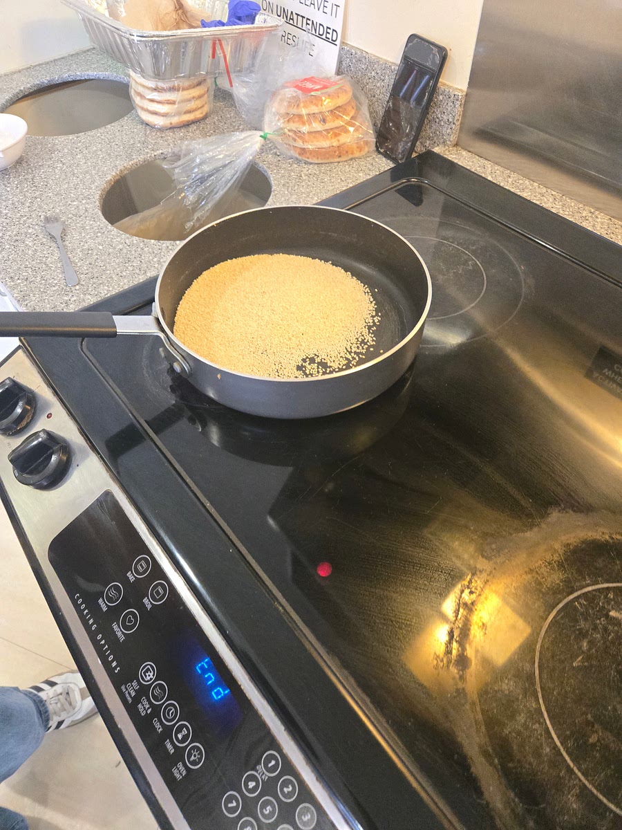 Toast sesame seeds, shift every minute until small black spots appear cover bottom of frying pan