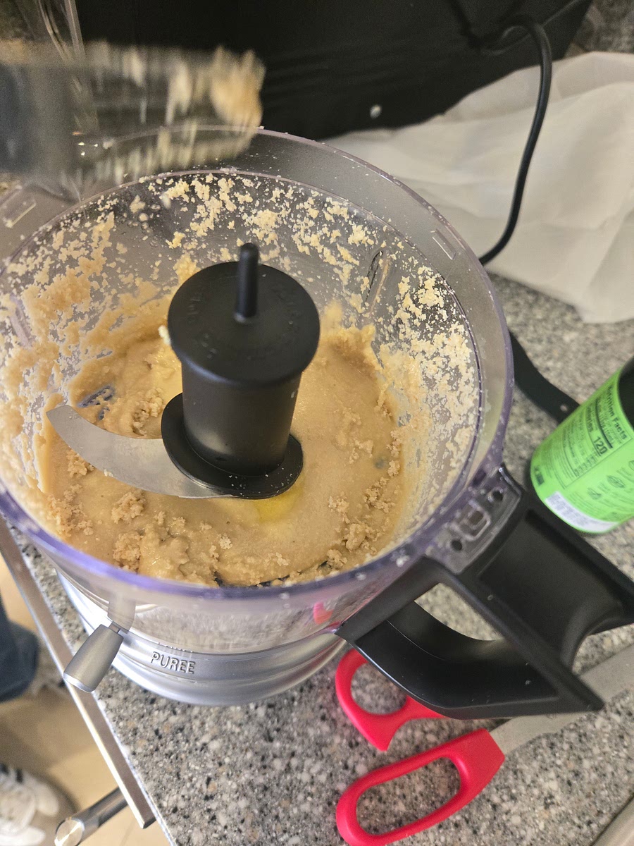 Add olive oil and blend again until paste