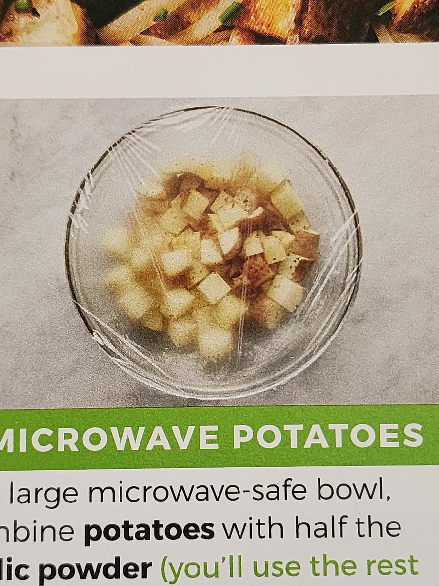In a large microwave-safe bowl, combine potatoes and half the garlic powder. Season generously with salt and pepper. Toss until evenly coated.