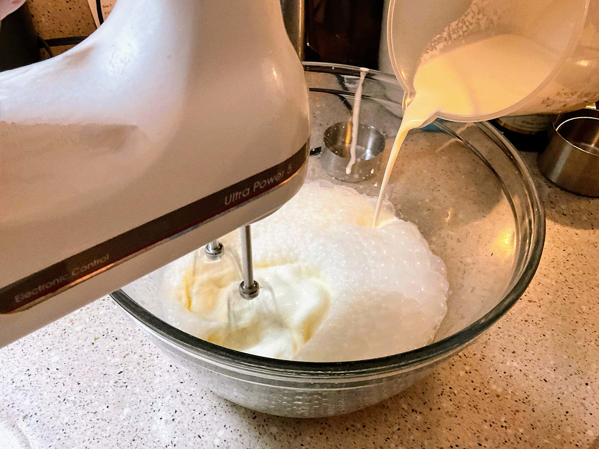 In a medium bowl, use a hand mixer on low speed
or whisk to combine the milk, sugar and salt until
the sugar is dissolved. Stir in the heavy cream and
vanilla. Stir in reserved strawberries with all juices.