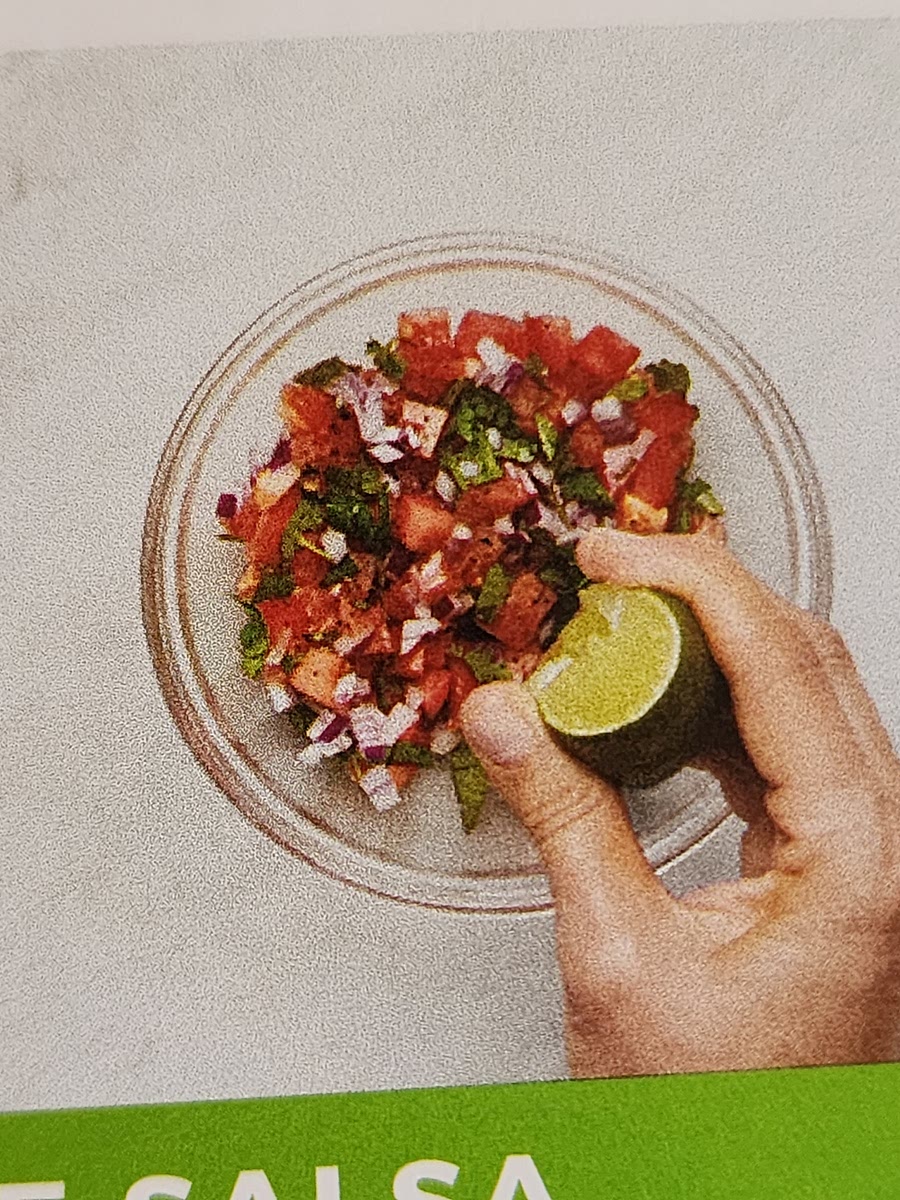 In a small bowl, combine tomato, chopped onion, half the lime zest, a squeeze of lime juice, a drizzle of olive oil, and jalapeño to taste. Season generously with salt and pepper.